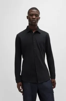 Camisa slim fit de punto de algodón con detalles de la marca bordados